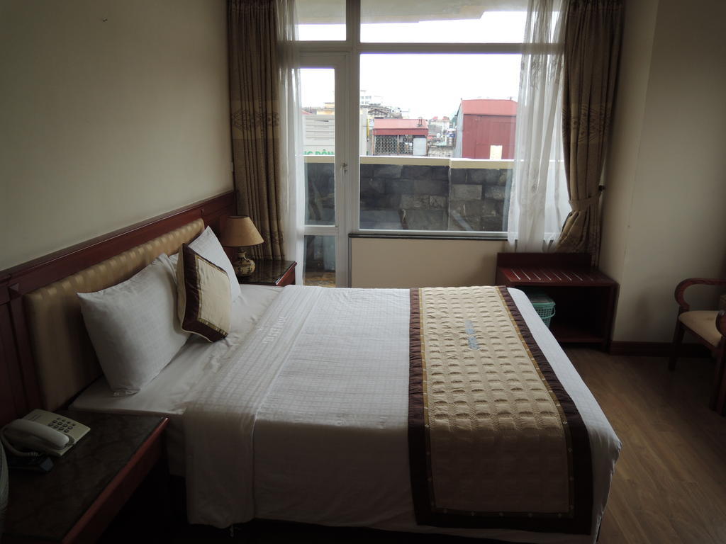 Satel Hotel Hanói Quarto foto
